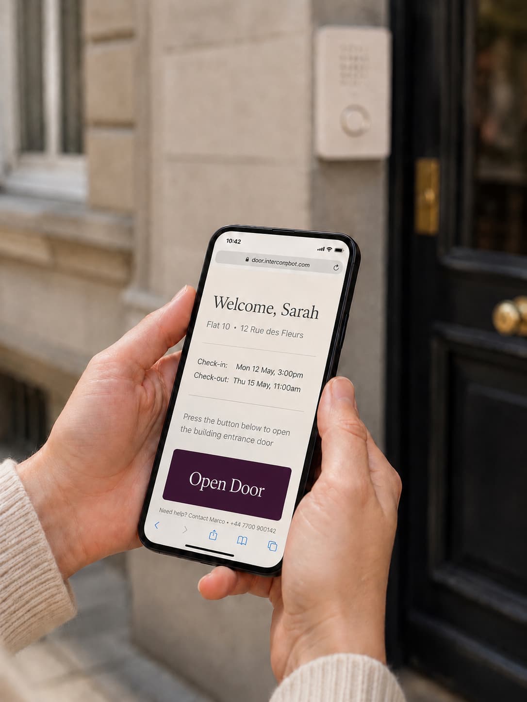 Guest viewing the IntercomBot access link on their phone outside a building